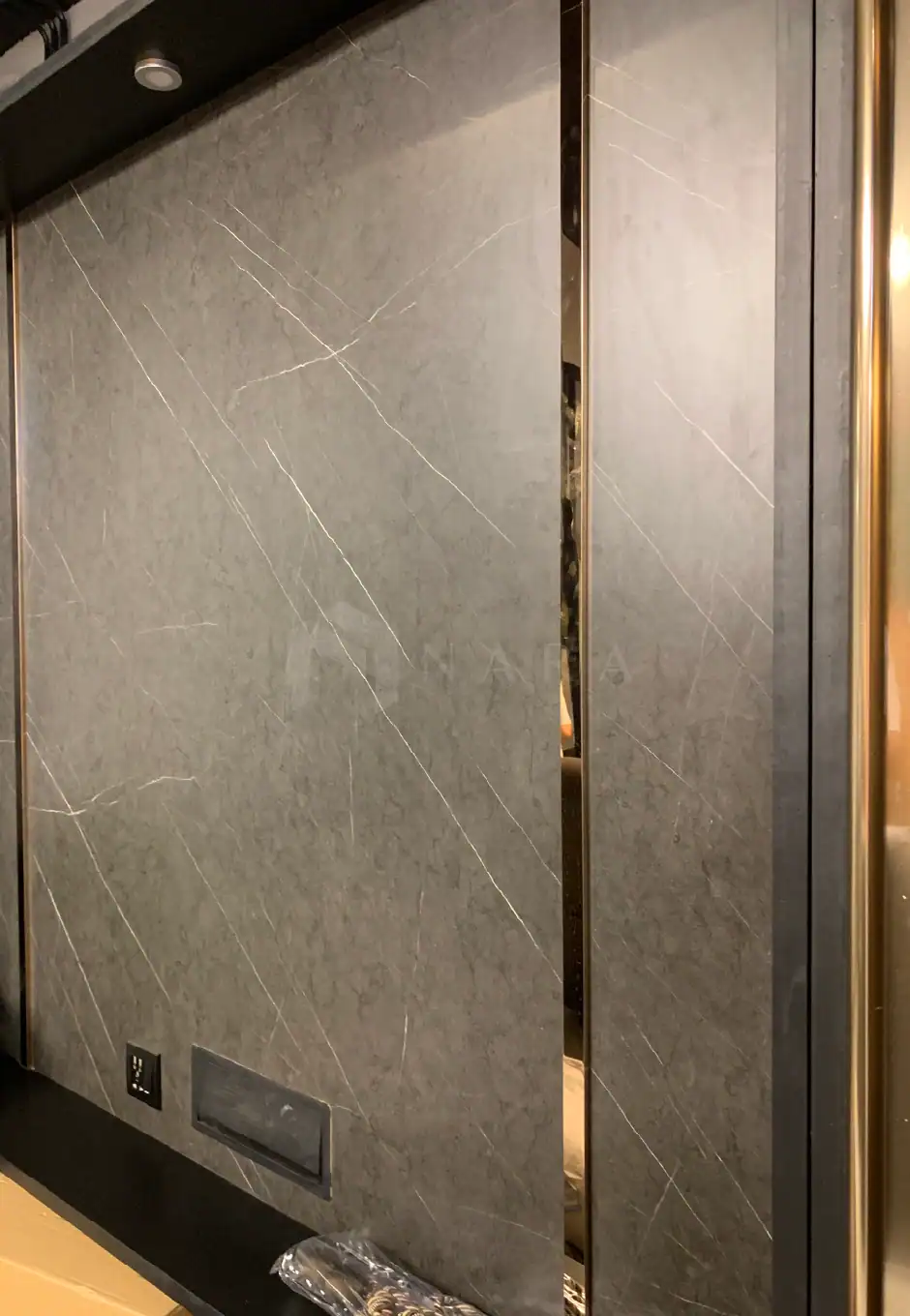 1. Gold-colored stainless steel trims and accents in a modern interior design setting, highlighting luxurious and elegant decor elements.