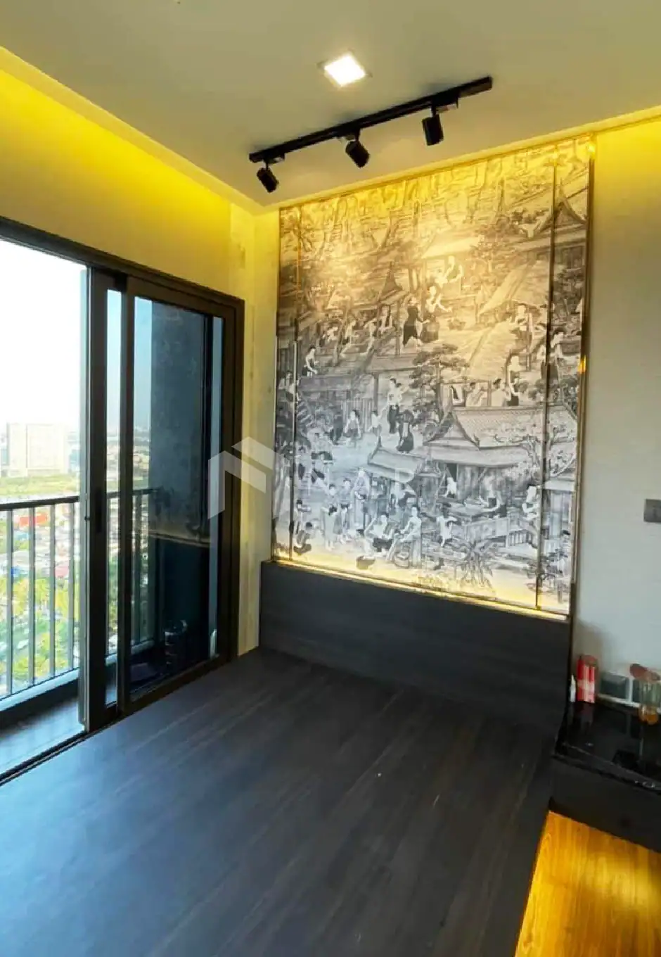 Shiny gold stainless steel corner trim used for decorative wall design with traditional artwork, enhancing aesthetic appeal in modern interior spaces.