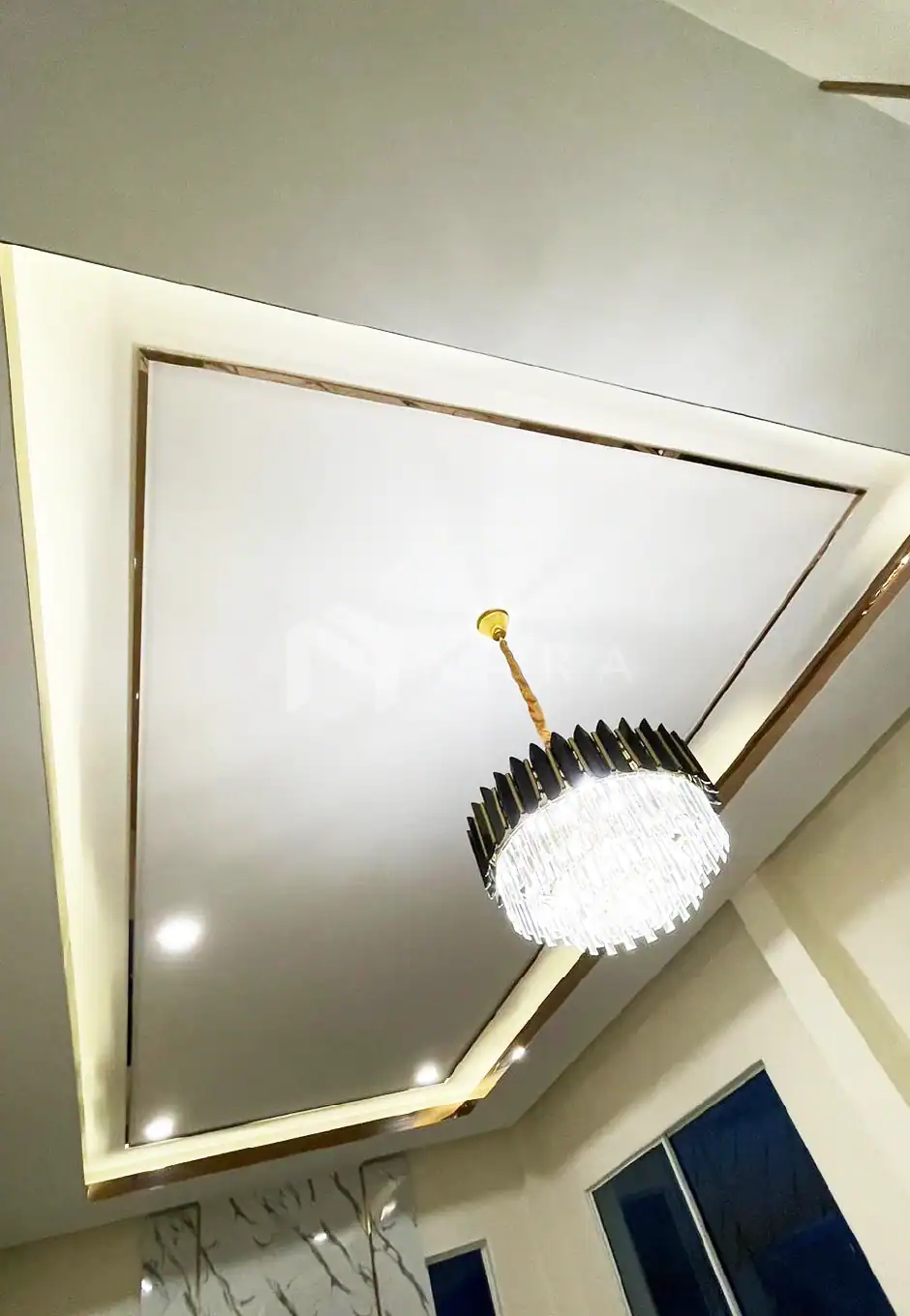 1. Gold-colored stainless steel decorative trim and ceiling corner accents in a modern interior setting.