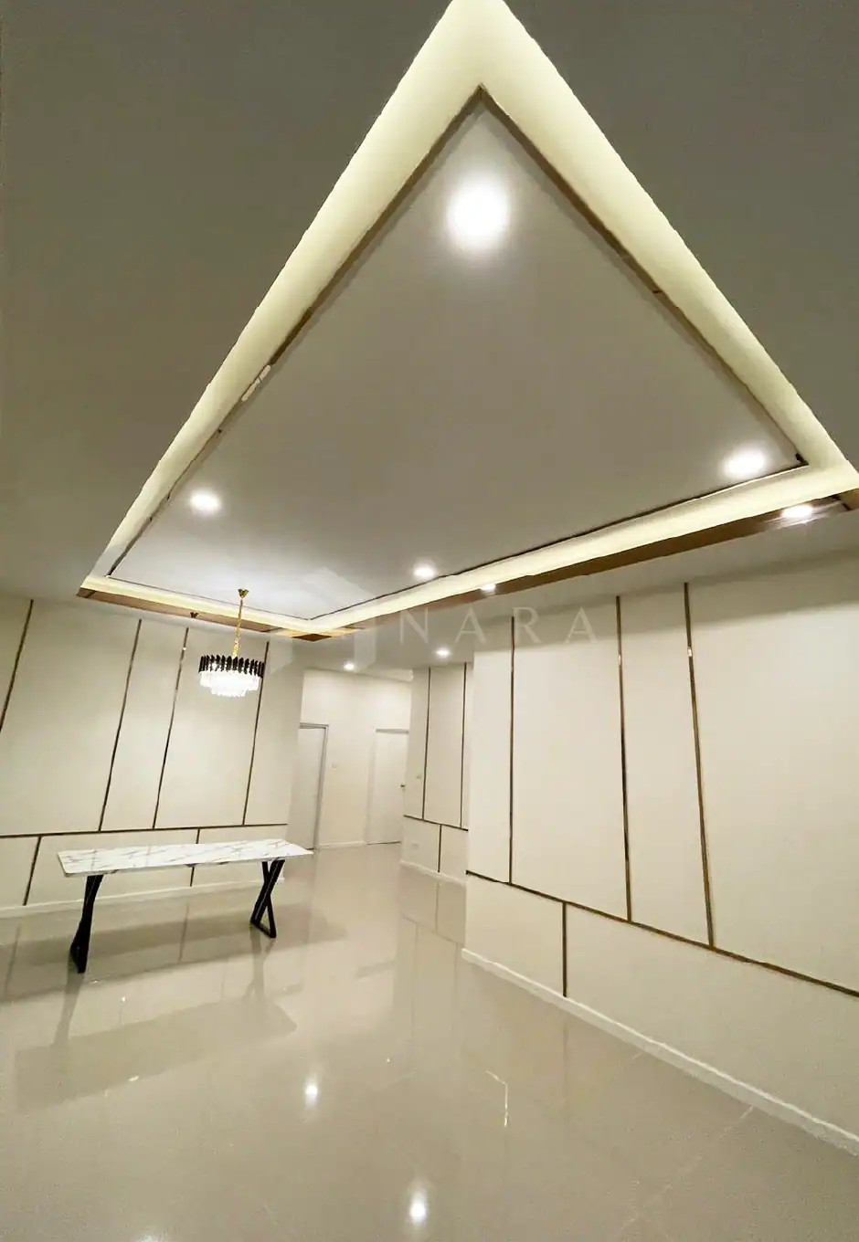 Elegant gold-colored stainless steel trim and decorative framework in a modern interior ceiling design.