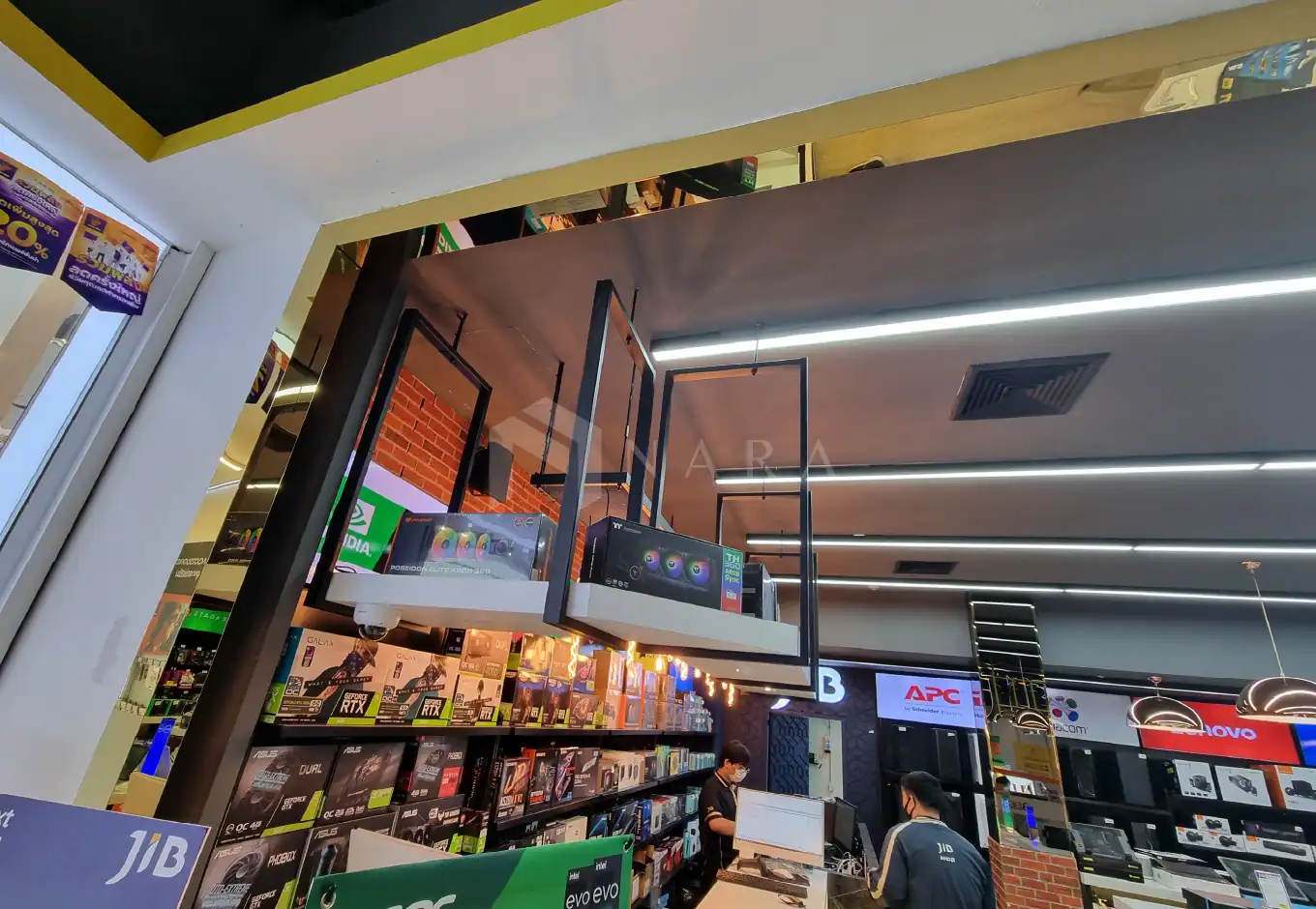 Shiny gold stainless steel decorative trims and framing accents are showcased in a modern retail store interior, enhancing space aesthetics with polished, premium quality stainless steel finishes.