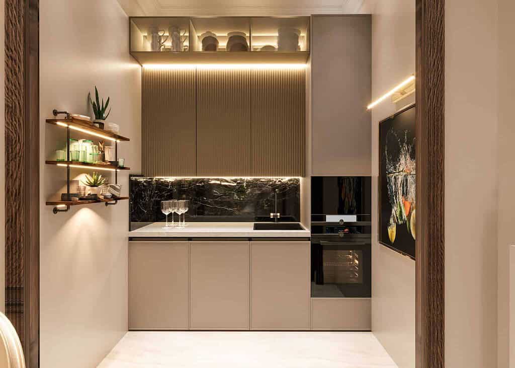 Modern kitchen with gold-colored stainless steel accents, sleek cabinetry, and ambient lighting, showcasing stainless steel decorative trims and fixtures.